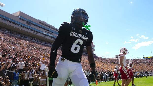 Colorado Buffaloes wide receiver Tar'Varish Dawson (6) reacts to his touchdown reception in the second quarter against the Nebraska Cornhuskers at Folsom Field